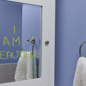 Photo of a bathroom mirror with the words I am Beautiful written on it for Eating Disorders Workshop