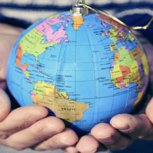 Photo of hands holding globe for Refugees and Trauma workshop