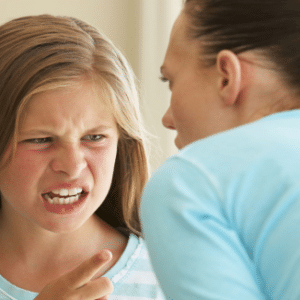 Photo of child yelling angrily at an adult for Regulation Strategies for Children and Youth Workshop