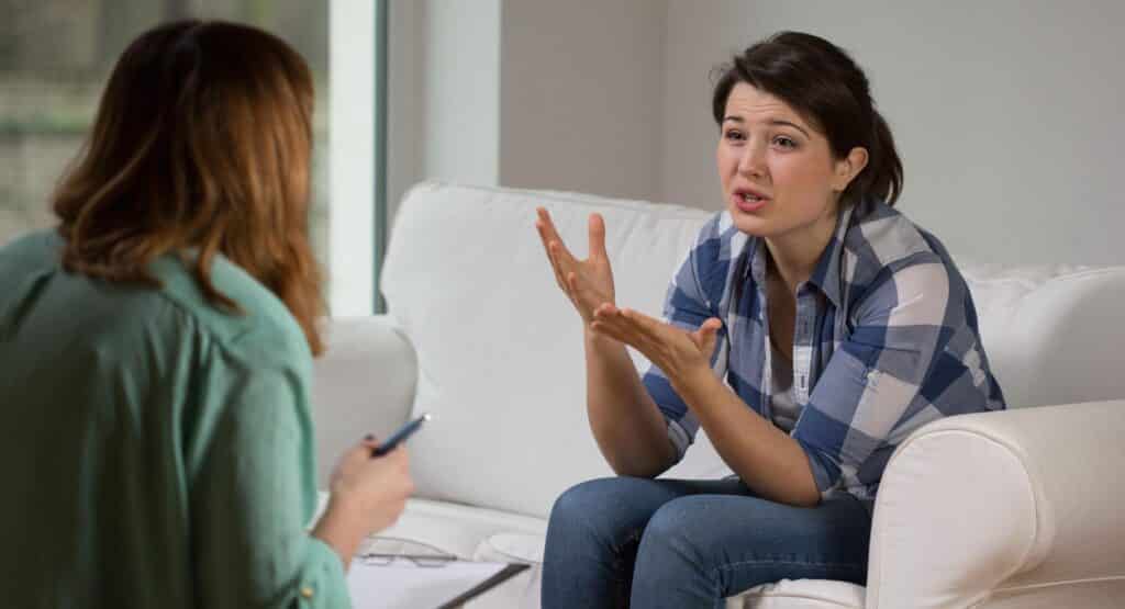 Photo of gesticulating woman talking with psychologist. For CTRI's Mental Health Counselling Skills Certificate Program.